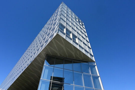 Geneva, Switzerland, Europe :  05.2026 :  Japan International Tobacco (JIT) - futuristic headquarters building with characteristic innovative self-shading glass facade