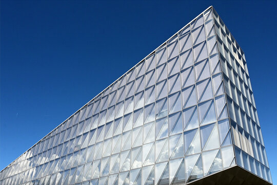 Geneva, Switzerland, Europe :  05.2026 :  Japan International Tobacco (JIT) - futuristic headquarters building with characteristic innovative self-shading glass facade