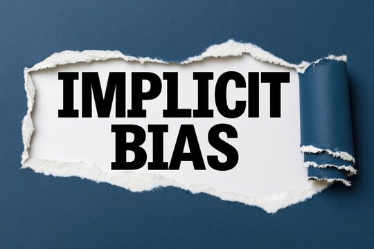 Written text implicit bias revealed under torn blue paper