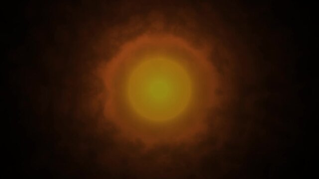 Mysterious glowing light orb in orange yellow through dark smoke abstract looping animation. Glowing orange yellow orb animation dark atmospheric smoke haze perfect for cinematic VFX.