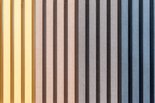 Composite fluted wall panel with multicolored slatted texture