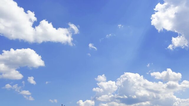Skydivers performing exciting group skydiving jumps against a beautiful blue sky with clouds and bright sunshine, showing teamwork, freedom, and extreme sports adrenaline