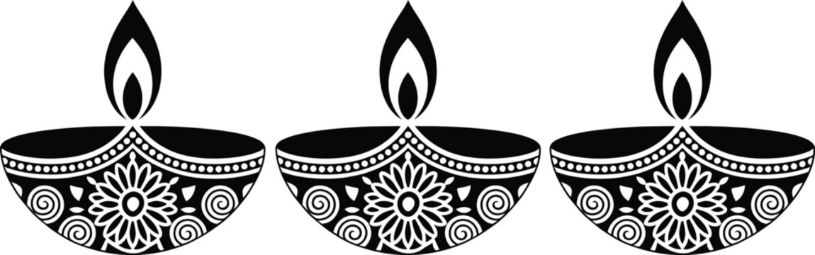 Three traditional oil lamps with flames on decorative bases