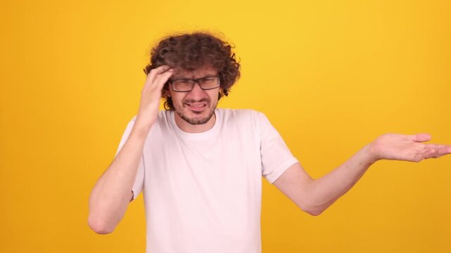 Sincere emotional person looking at the camera and gesticulating expressively with hands, conveying dynamic lifestyle energy and authentic human expression.