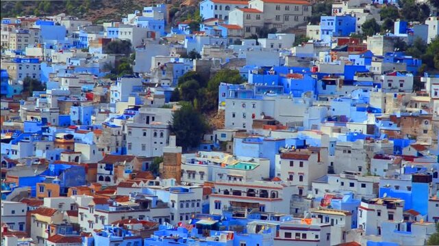 Blue-washed buildings cascade down the hillside in Chefchaouen, Morocco. Traditional Moroccan architecture. Famous Blue Pearl city.