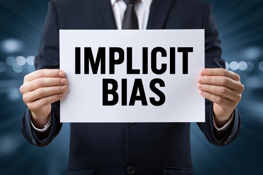 Male manager presenting implicit bias diversity awareness sign