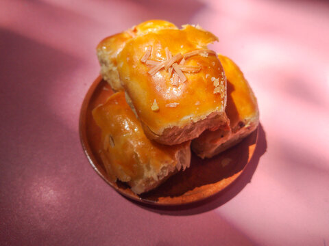 Delicious Pisang Bolen Golden Baked Pastry Bites with Cheese Topping
