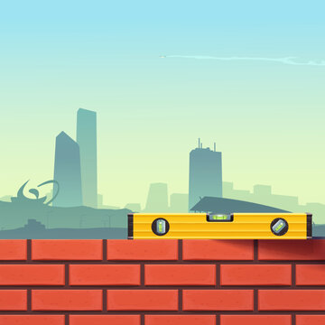 yellow level tool on brickwall city behind