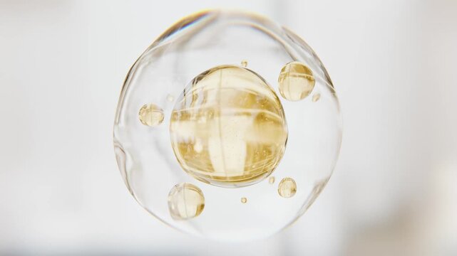 Golden serum liquid bubbles. Luxury beauty cosmetics macro 3D abstract background. Bio moisturizer essence gel or oil drops. Collagen fluid molecule. Moisturizing peptide face cream for skin lifting