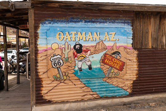 Oatman, Arizona, USA  - April 6th 2026: Colorful mural painted on a corrugated metal wall in historic Oatman, Arizona, along Route 66