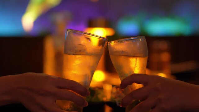 food and drink male friends are happy drinking beer and clinking glasses at a bar or pub.