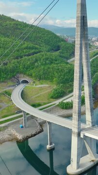 Aerial shot of the Halogaland Suspension Bridge near the town of Narvik in Northern Norway. Vertical Video.