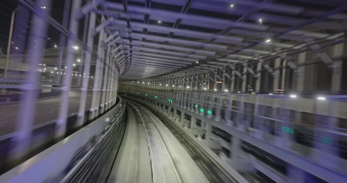 Train goes through city at night,  concept of speed