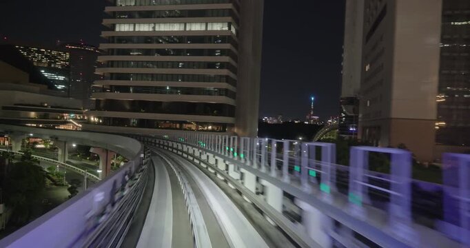Train goes through city at night,  concept of speed