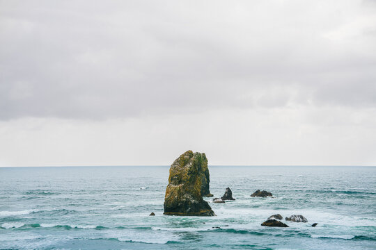 Rock Formation Surrounded By Water In The Pacific Northwest