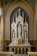 Obraz premium Church of St Alphonsus interior in Rome Italy. Neogothic marble altar with Virgin Mary statue gothic arches and religious decorations landmark detail