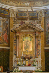 Fototapeta premium Main altar of Santa Maria ai Monti church Rome Italy baroque high altar with ancient Madonna icon fresco by Giacomo della Porta