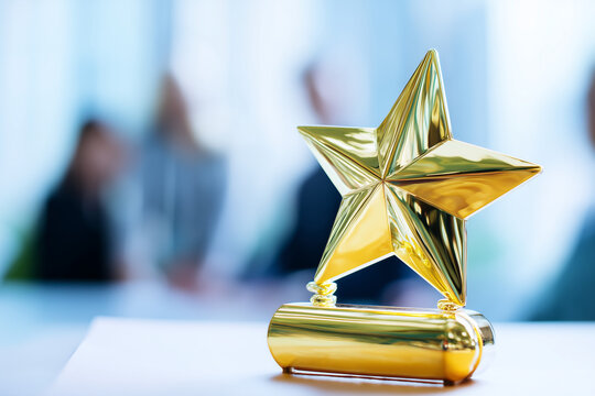Golden star award trophy with blurred business professionals in the background. Symbol of achievement, excellence, recognition, and corporate success.