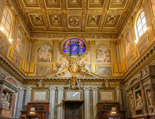Obraz premium Interior counter-façade of the Basilica of Santa Maria Maggiore with golden coffered ceiling, stained glass window and frescoes, Rome, Italy