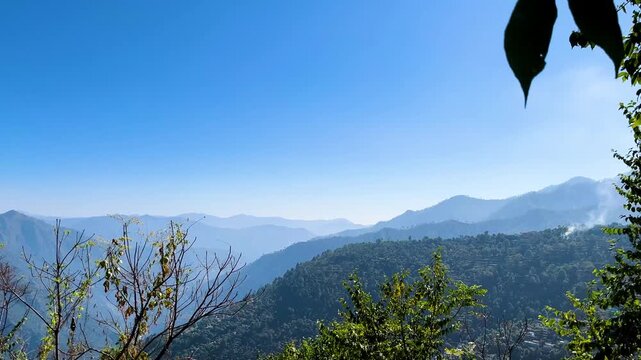 Scenic Garhwal Mountain Landscape. Forested Hills Under Clear Blue Sky, Panoramic Nature View in Bright Daylight Travel Tourism, Adventure Exploration, Environmental Conservation, Rural Lifestyle Outd