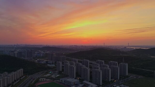 Aerial photography of urban landscapes and city skylines at sunset.