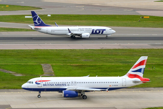 London, England, UK - 10 April 2026: British Airways Airbus A320 taxiing for take-off at London Heathrow airport. A LOT Polish Airlines Boeing 737 is on the runway in the background