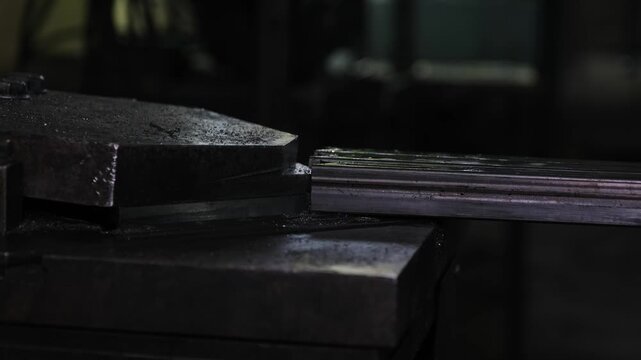 Industrial notching of steel profile tube on metalworking machine, precision fabrication process, 4K