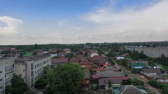 Aerial view of mixed residential neighborhood with brick apartments and red roof houses