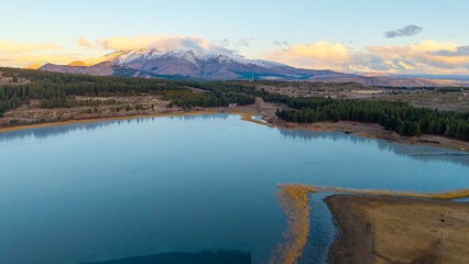 Laguna La Zeta and snowy mountains at sunset near Esquel, Chubut. © Marcio Eneas