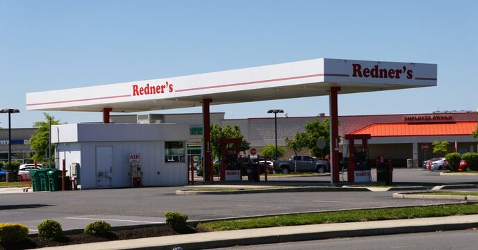 Milford, Delaware, U.S - May 21, 2026 - Redner's gas station with canopy, fuel pumps, and adjacent grocery store building in a suburban commercial area.