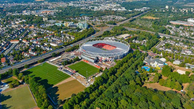 Aerial drone view of BayArena, Bayer Leverkusen Bundesliga champions, stadium next to Bayer AG industrial complex, Leverkusen, Germany