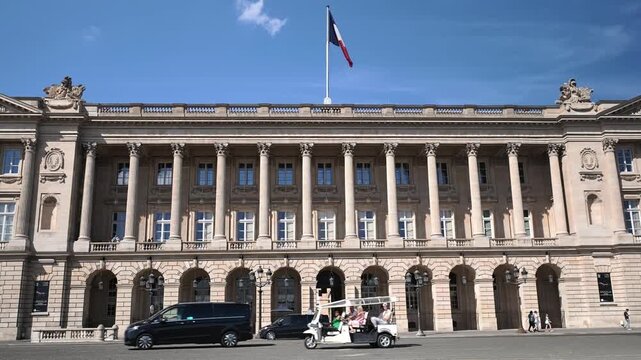 People and Cyclists at Place de la Concorde with Hotel de la Marine Paris