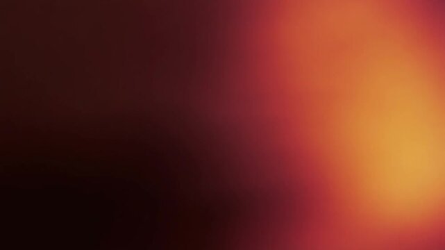 Abstract red background with soft out of focus light. Dark burgundy gradient texture with subtle orange highlights. Blurred aesthetic for corporate video backdrops and presentations.