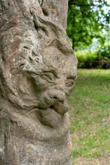 Obraz premium Weathered Stone Gargoyle Sculpture at Limburg Monastery Ruins in Bad Dürkheim, Germany