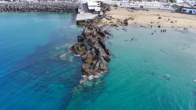 Aerial Drone View of Scuba Divers Training in Crystal Clear Coastal Waters of Puerto del Carmen Lanzarote