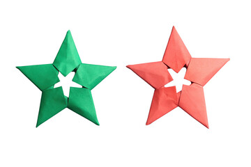 Obraz premium Green and red origami stars side by side on transparent background simple craft decorations symbolic objects.