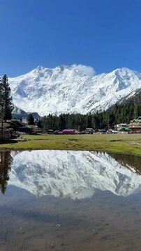 Fairy Meadows Reflection Lake with Nanga Parbat Mountain Peak in Pakistan.
