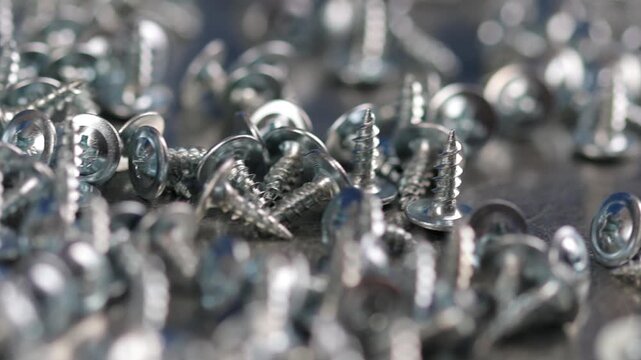 Metal screws for fastening equipment. Soft focus. Close-up. 