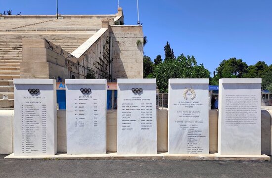 Photo of the marble monuments within the Panathenaic Stadium, honoring the history of the Olympic Games. 