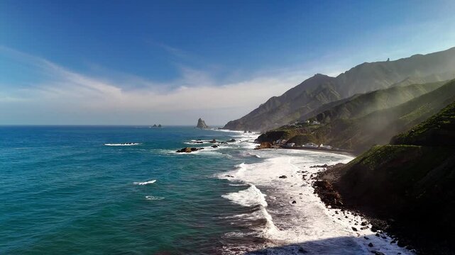 Aerial view of ocean sun rays and Roque de las Bodegas, Tenerife