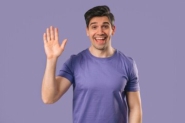 Friendly 30s aged man Waving Hand - Hello, Hi, salute, chao. Greetings on violet © kohanova1991