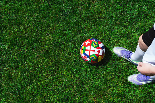  Feet of soccer player step on soccer ball for kick off in stadium
