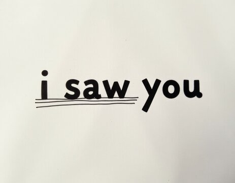 A white shirt with handwritten text 'I saw you'