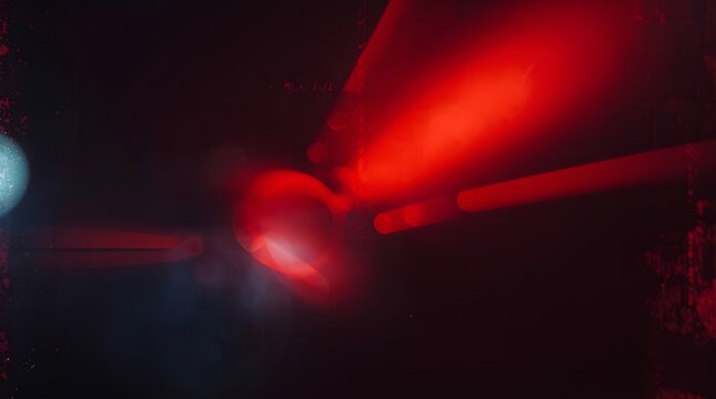 Overlay effect featuring light leaks with motion blur, including red light and retro film distressed flares on a black background. Captures the essence of analog film burn with rays of light, ideal fo