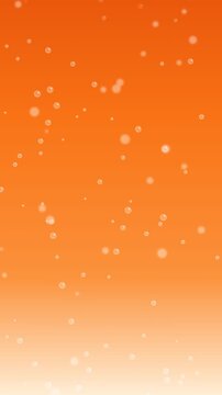 Air bubbles rising up in carbonated orange liquid background