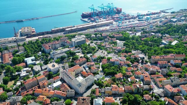 Aerial view of Rijeka, Croatia, showcasing its vibrant port, residential areas, and the beautiful Adriatic Sea under a clear sky. A hub of commerce and coastal charm. Rijeka Gateway