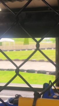  Blurry Go Carts on Amusement Park Track - Cinematic Filler Shot - ALT - Vertical.