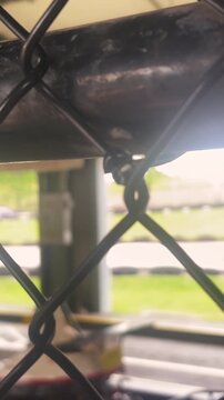 Blurry Go Carts on Amusement Park Track - Cinematic Filler Shot - Vertical.