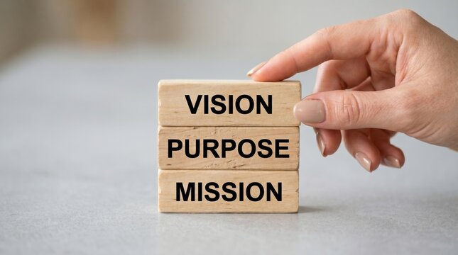 Vision purpose mission wooden blocks concept with hand holding