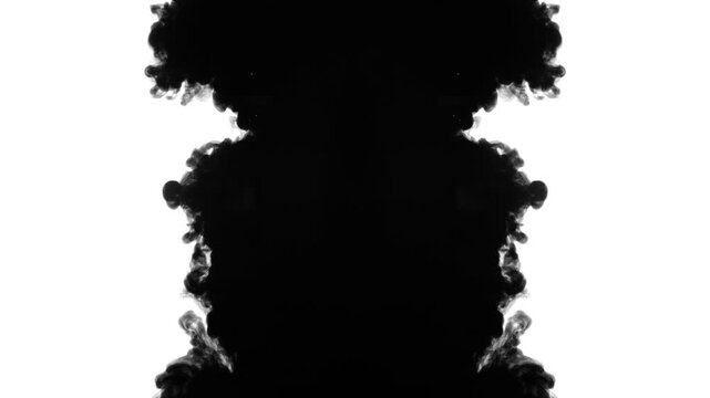 An abstract, slow-motion video showing black ink expanding symmetrically in water against a clean white background. creating beautiful fluid textures and organic, Rorschach-like patterns